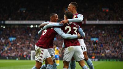 Douglas Luiz celebrates with teammates Philippe Coutinho, Ashley Young and Jacob Ramsey after scoring the second goal. Getty