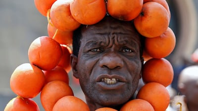 A supporter of the opposition National Super Alliance (NASA) wears oranges during a protest calling for the sacking of election board officials involved in August's cancelled presidential vote, in Nairobi, Kenya. Baz Ratner/ Reuters