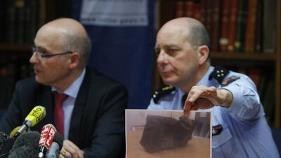 General David Galtier, flanked by Marseille prosecutor Brice Robin, left, displays a picture showing the second black box from the Germanwings plane that crashed in the French Alps last week, during a press conference in Marseille, southern France on April 2, 2015. Claude Paris/AP Photo