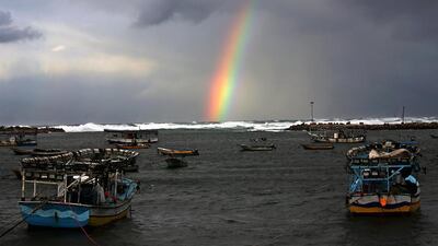 A rainbow seen from the Gaza port over Gaza City, during rain in the Gaza Strip. Mohammed Saber / EPA