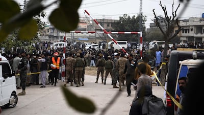 Security services personnel at the scene. Police officials said an attacker was stopped at the gate of the mosque before detonating the bomb. EPA
