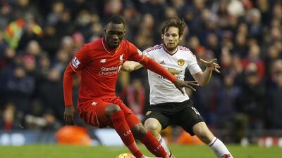 Manchester United's Daley Blind, right, defends Liverpool's Christian Benteke. Reuters / Carl Recine