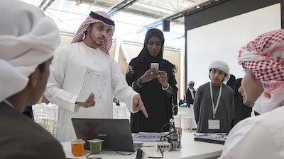 Teachers volunteered to help the children at Tech Quest, held at the Masdar Institute in Abu Dhabi over two weeks. Mona Al Marzooqi / The National