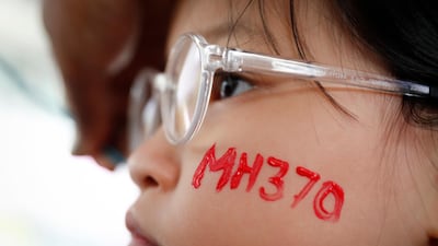 A girl has her face painted during the Day of Remembrance for MH370 event in Kuala Lumpur, Malaysia. New Transport Minister Anthony Loke says the search for missing Malaysia Airline Flight 370 ends next Tuesday after a 90-day period under a "no cure no fee" agreement with a private US firm. Vincent Thian / AP