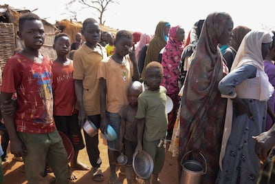 Newly arrived Sudanese queue for food at Thobo Camp, in South Kordofan, Sudan, on January 29. Reuters