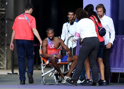 Bronze medalist Noah Lyles of Team United States is taken off from the track with a wheelchair. Getty Images