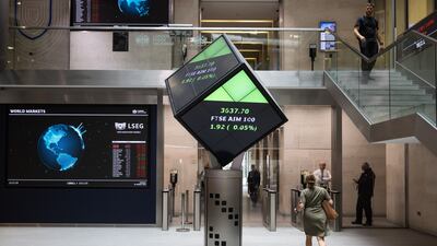 Stock price information is seen inside the London Stock Exchange Group's office atrium. The FTSE 100 snapped a three-day losing streak and added 0.5 per cent at the close of trading on Friday, boosted by a 2 per cent gain in energy stocks. Bloomberg