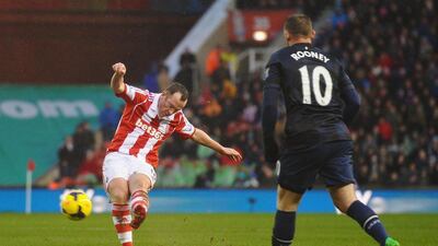 Charlie Adam, left, scores his second goal to lead Stoke City past Manchester United 2-1 on Saturday. Laurence Griffiths / Getty Images