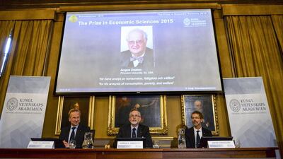 A picture of British economist Angus Deaton is flashed on the screen during the announcement of the winner 2015 Nobel Prize in Economics. Maja Suslin / TT News Agency / Reuters