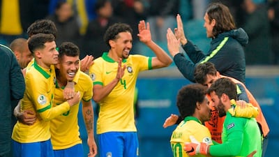 Brazil's players celebrate after defeating Paraguay in their penalty shoot-out. AFP