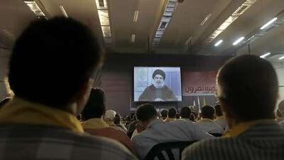 Hezbollah leader Sheik Hassan Nasrallah speaking on a screen during a ceremony marking the birth of one of Shiite Islam's most important saints. He called for the quick execution of Lebanese citizens sentenced to death for spying for Israel