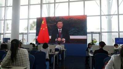 Chinese President Xi Jinping is seen on a giant screen at a media centre, as he delivers via video link a keynote speech at the opening ceremony of the Boao Forum for Asia, in China. Reuters