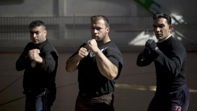 Inside one of Gaza City’s handful of sports centres, dozens of sweaty men — young and not so young — are put through their paces in various martial arts and other exercises to stay in shape for the job.