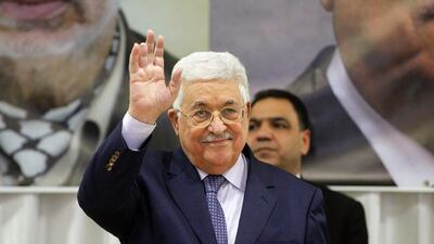 Palestinian president Mahmoud Abbas gestures ahead of a Christmas lunch with members of the Christian Orthodox community on January 6, 2017, in Beit Sahur, near the West Bank city of Bethlehem. Mr Abbas has written to Donald trump warning him of the dangers of moving the US embassy from Tel Aviv to Jerusalem. / AFP / HAZEM BADER
