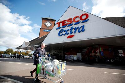A woman pushes a shopping cart past a Tesco supermarket in Hatfield, Britain. Unlike last year, food prices rose in October with people stocking up on potatoes and fruit. Reuters