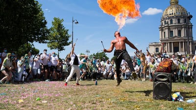 An artist performs as nightclub workers demonstrate in Paris near the health ministry office to demand reopening of their venues that have been shut down because of the coronavirus crisis AFP