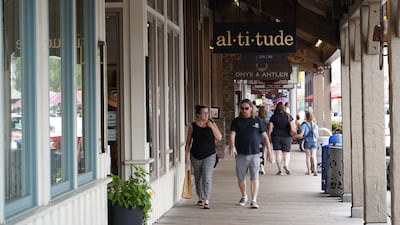 People walk past high-end shops in Jackson, Wyoming. Willy Lowry / The National