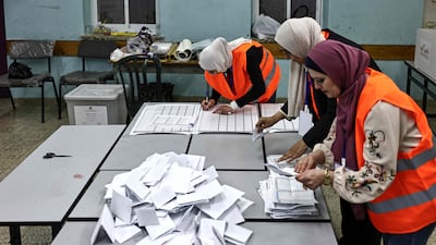 Palestinian electoral employees begin counting votes for the municipal elections after the close of polling stations in the Israeli-occupied West Bank city of Al Bireh. AFP