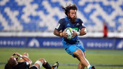 Auckland Blues player Rene Ranger beats the tackle against Leonardo Senatore of the Jaguares during their Super Rugby match on Saturday. Michael Bradley / AFP / April 2, 2016