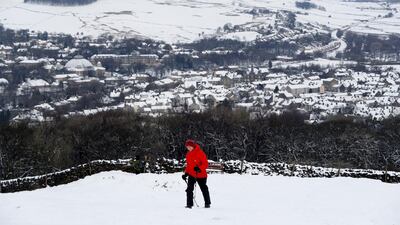 A walker treks towards Solomon's Temple after snow fall in Buxton. Darren Staples/ Reuters