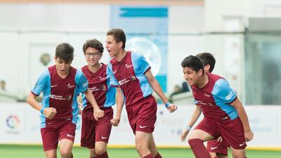 The Philadelphia Private School players celebrate scoring the winning goal during the final. Courtesy du Football Champions