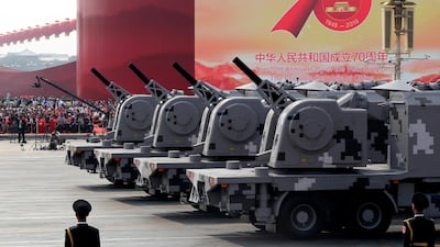 Military vehicles roll down Tiananmen Square. AP Photo