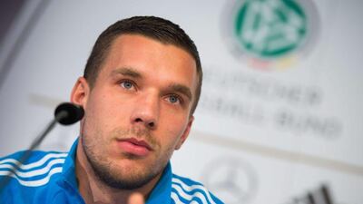 Lukas Podolski takes questions at a Germany press conference on Tuesday ahead of the country's Euro 2016 qualifier against Gibraltar. Lukas Schulze / AFP / DPA / November 11, 2014