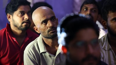 Volunteer medics visit workers' accommodation in Dubai to advise people who work outdoors on how to deal with heat. Chris Whiteoak / The National