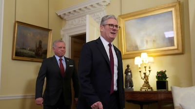 Mr Starmer leads King Abdullah into 10 Downing Street. Reuters
