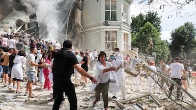 Volunteers form a line, passing stones and debris to each other in a bid to clear the rubble. Reuters