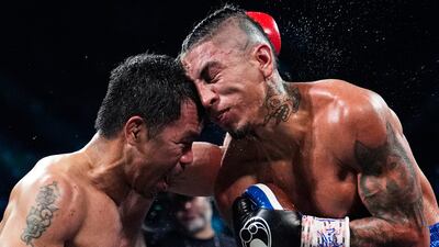 Manny Pacquiao, left, fights Mario Barrios to a draw in a welterweight title boxing match on July 19 in Las Vegas, Nevada. Pacquiao is asking for a re-match. AP