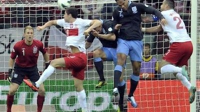 An error from Joe Hart, left, cost England two points in the World Cup qualifier in Poland.