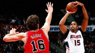 Al Horford of the Atlanta Hawks shoots over Pau Gasol of the Chicago Bulls during Atlanta's NBA win on Monday night. Kevin C Cox / Getty Images / AFP / December 15, 2014