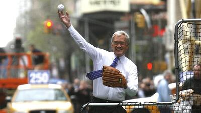 This April 14, 2008 file photo shows David Letterman throwing a pitch to New York Mets third baseman David Wright outside the Late Show with David Letterman studios in New York. AP
