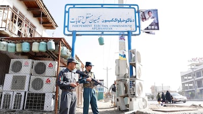 Afghan security officials attend the scene of an attack. EPA