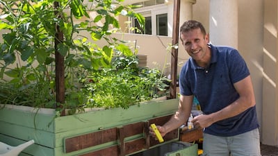 Jason Renoux with his home aquaponics system. Victor Besa for The National