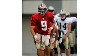 Drew Brees, in front, says it is time to 'hunker down' and stay focused amid 'the hoopla'.