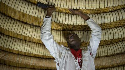 The skilled workman concentrates on his intricate work.