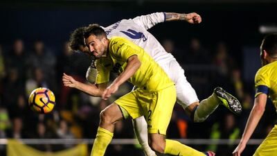Real Madrid defender Sergio Ramos vies with Villareal defender Mario Gaspar, left. Biel Alino / AFP