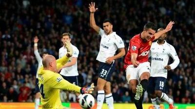 Manchester United's Robin van Persie tries to shoot past Tottenham Hotspur's Brad Friedel.