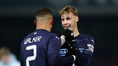 Cole Palmer with Kyle Walker after the match. Reuters