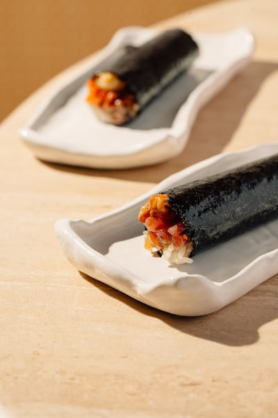 The akami tuna and foie gras handroll is an unusual but delicious flavour combination. Photo: Yubi