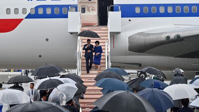 South Korea's President Moon Jae-in and his wife Kim Jung-sook arrive at Kansai airport in Izumisano city ahead of the G20 Summit in Osaka, Japan. AFP