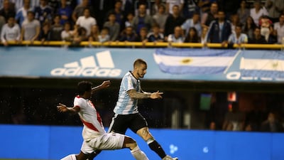 Dario Benedetto of Argentina and Miguel Araujo of Peru in action. Agustin Marcarian / Reuters