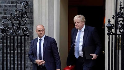 Britain's Prime Minister Boris Johnson leaves from 10 Downing Street to make a statement to MPs in the House of Commons following the publication of the Gray report. AFP