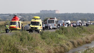 Ambulances on the road near the site of Ural Airlines A-321 passenger plane emergency landing outside Zhukovsky airport in Ramensky district of Moscow region, Russia. A-321 with 226 passengers and seven crew members on board en-route from Moscow to Simferopol made emergency landing after a right engine failure following the plane's colliding with seagulls shortly after take-off. Ten people were hospitalized following the accident. EPA