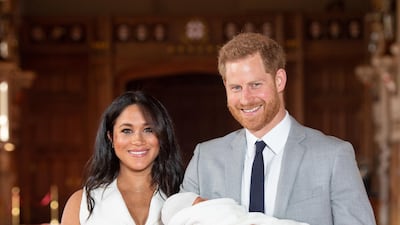 Prince Harry and Meghan, Duchess of Sussex pose with their newborn son Archie Harrison Mountbatten-Windsor in St George's Hall at Windsor Castle on May 8, 2019 in Windsor, England. Getty Images