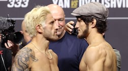 UFC featherweight champion Alexander Volkanovski, left, faces off against Movsar Evloev ahead of their headline match at UFC 333 in Abu Dhabi. Chris Whiteoak / The National