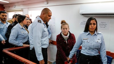 Palestinian teenager Ahed Al Tamimi, 16, being hauled before an Israeli military court last month / AFP