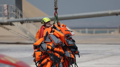 A crew member with life jackets at the Port de Commerce in Boulogne, northern France. AFP